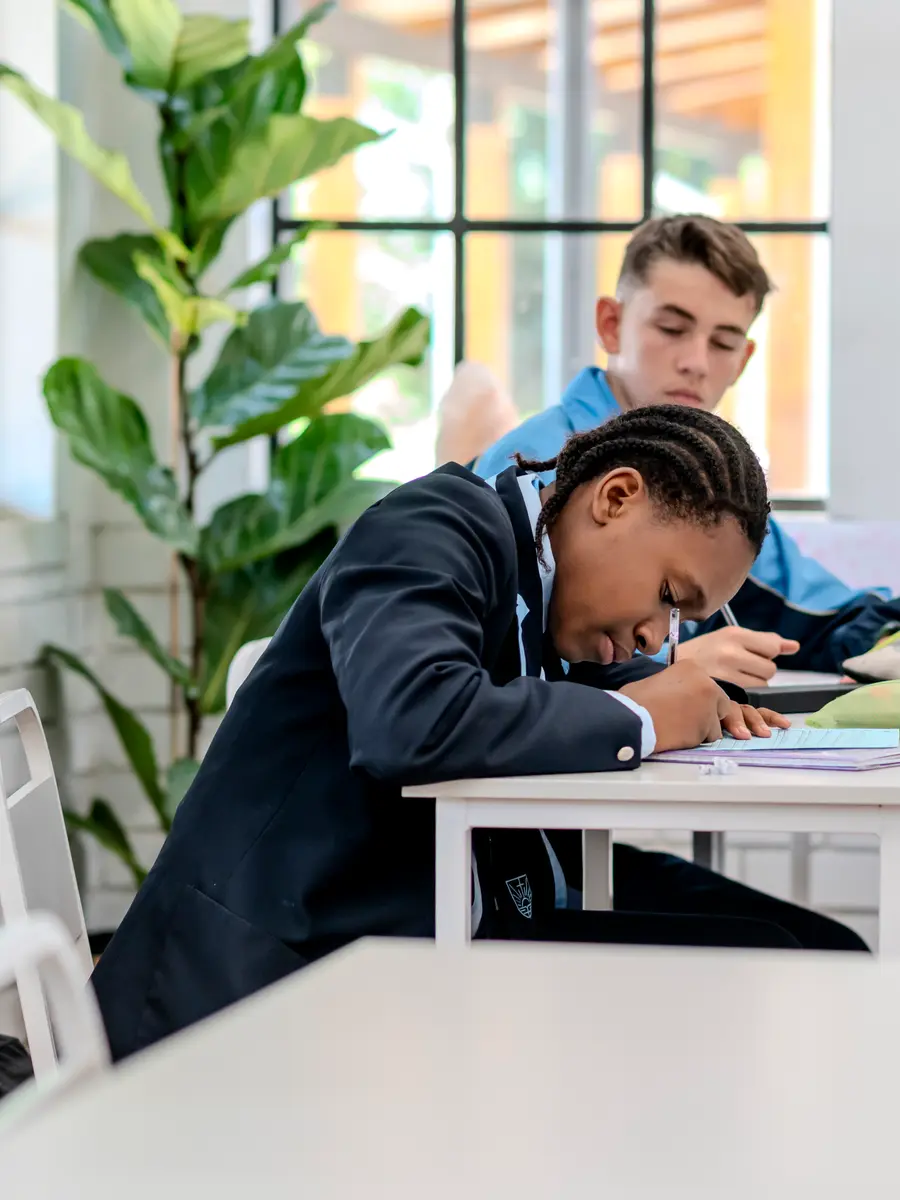 High School students working together at their desks