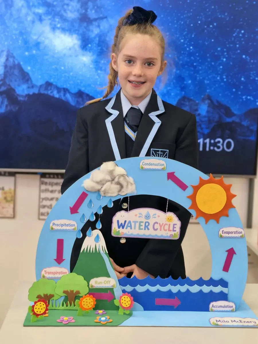 A Preparatory School girl presenting her water cycle science project