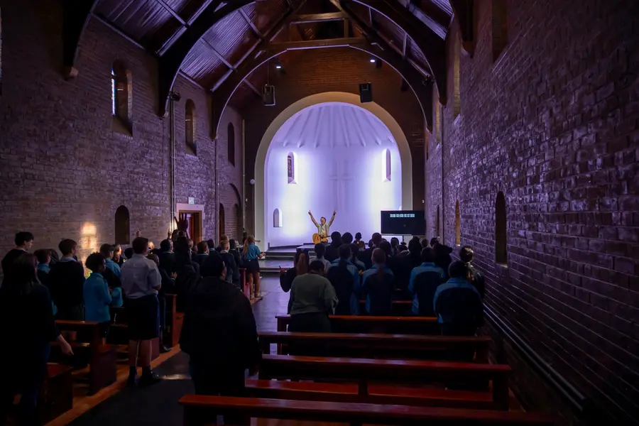 Students gathered for worship inside the historic stone chapel