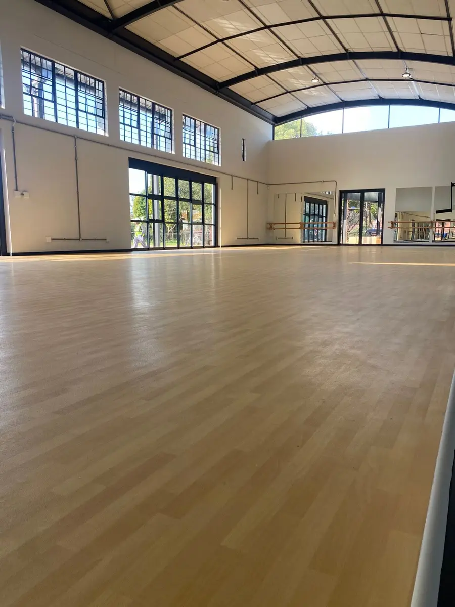The dance studio, a high-ceilinged hall with a sprung timber floor