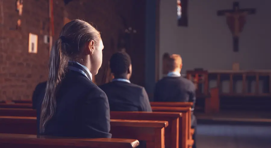 High School students sitting quietly in the chapel