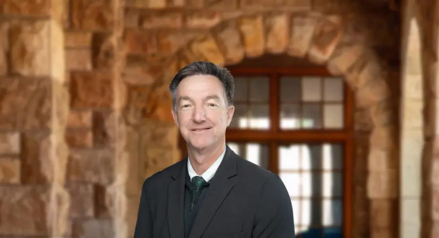 Michael Schwartz, Executive Head, in the stone colonnade