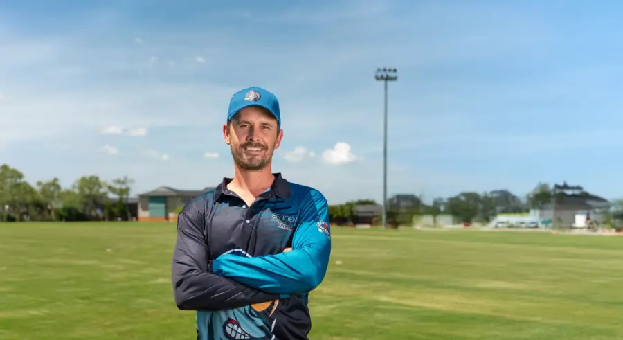 Hermann van Aswegen, Head of Sport, standing on a cricket field